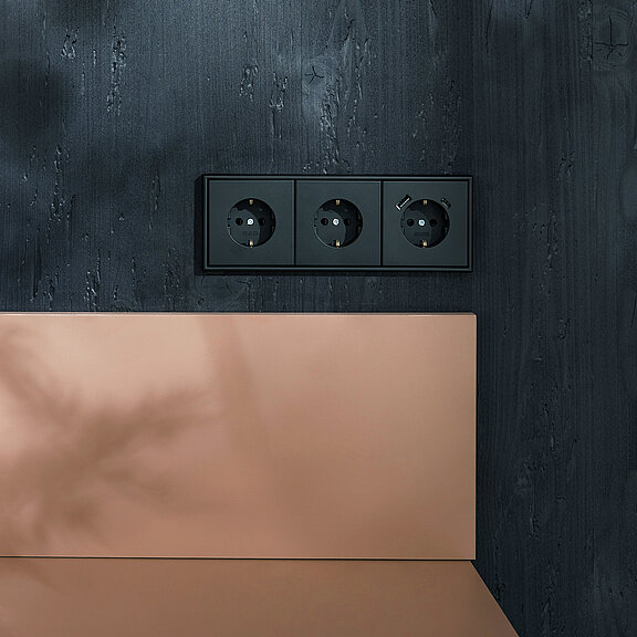 Розетки черные матовые каталог